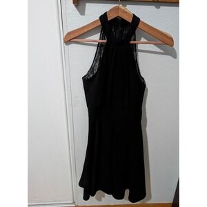 Elegant and modern, this BCBGeneration black halter dress combines classic sophi